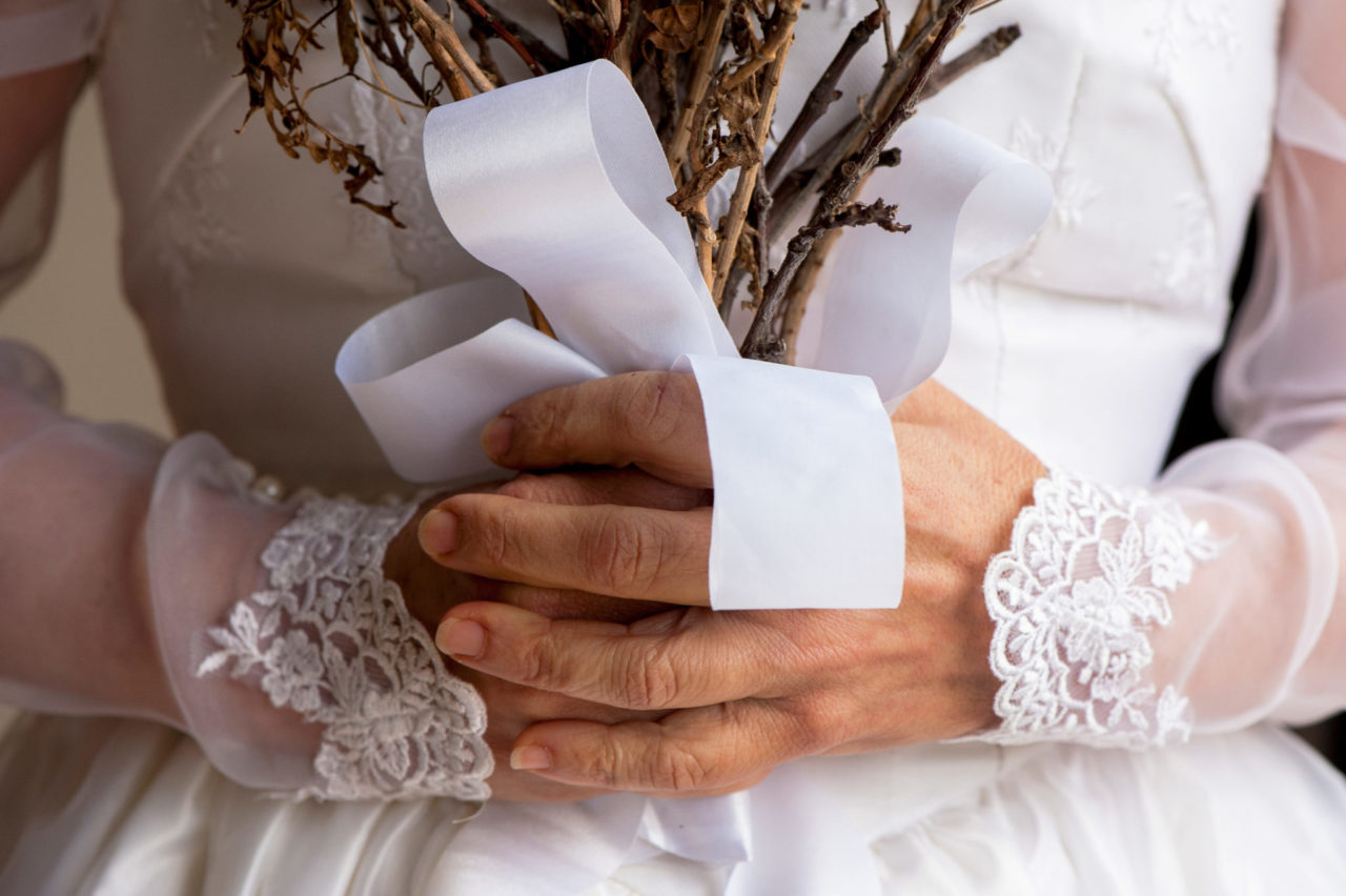Hands holding twigs