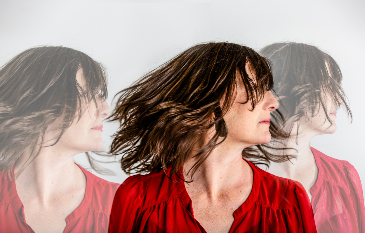 A portrait of a woman looking to the right repeated three times with different opacity