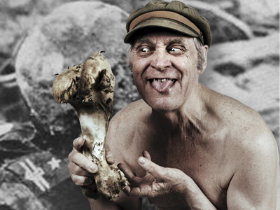 A man with a hat, holding a bond in one hand and poking our his tongue
