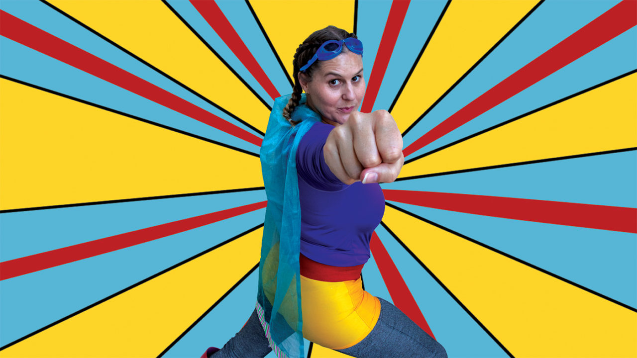 a pop art style image with a super hero woman standing in a strong stance with her fist out. The background is yellow, blue and red stripes