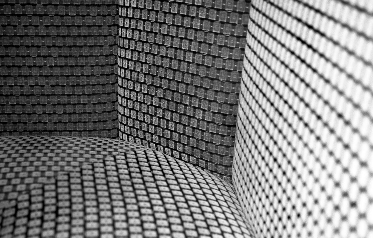 Black and white Corner of patterned couch.