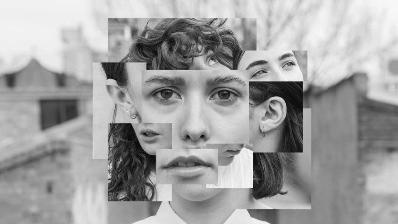 A black and white collage comprised of snippets of a face. Eyes, ears, lips, and hair are layered together.